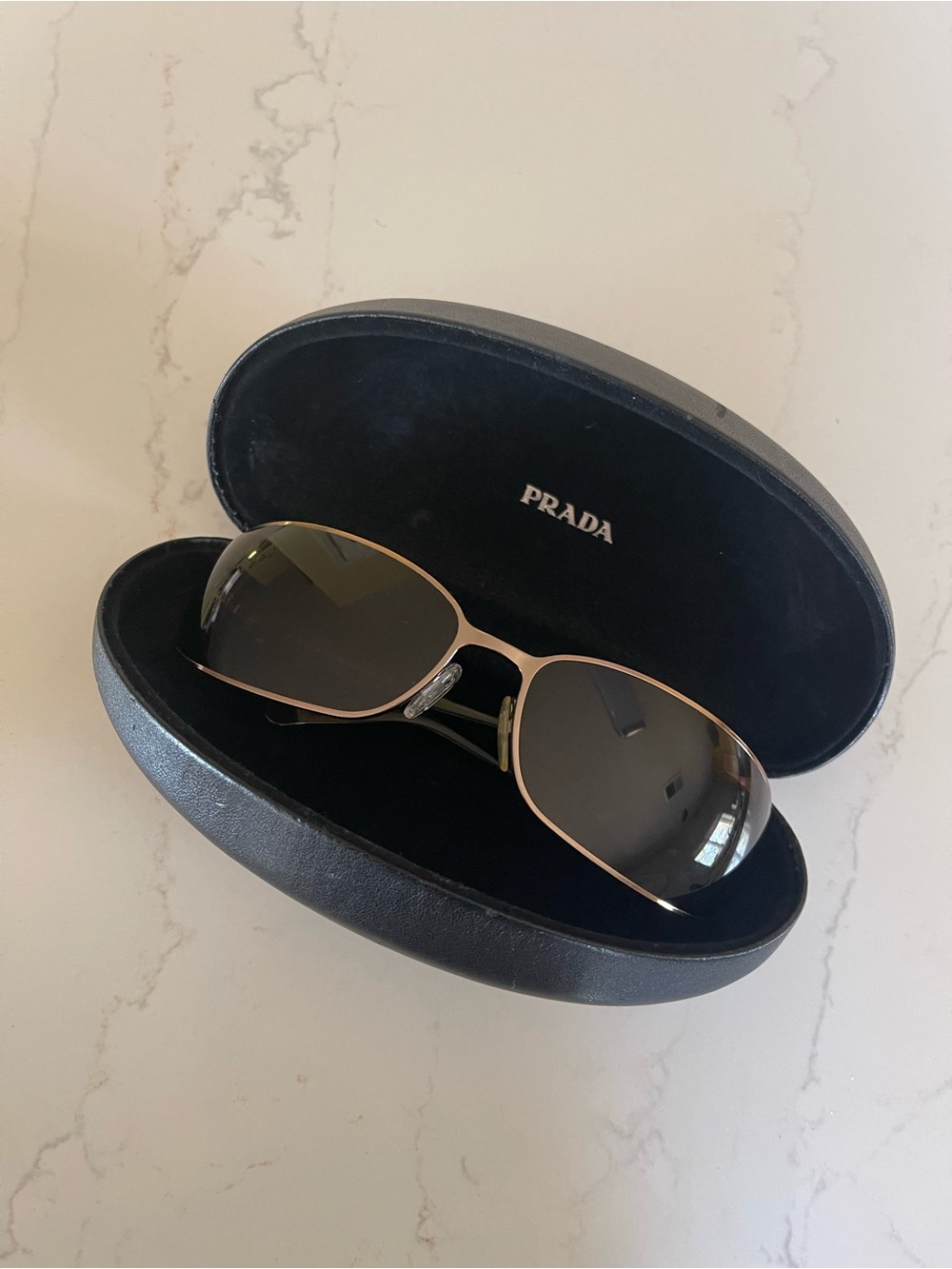 Prada Sunglasses with Brown Temples and Silver Hinges